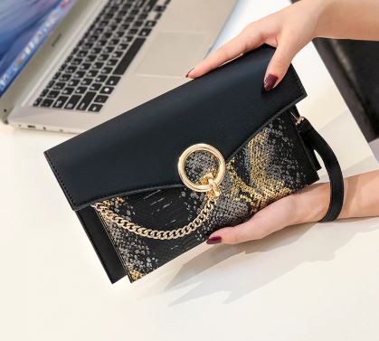 Clutch bag with snake pattern